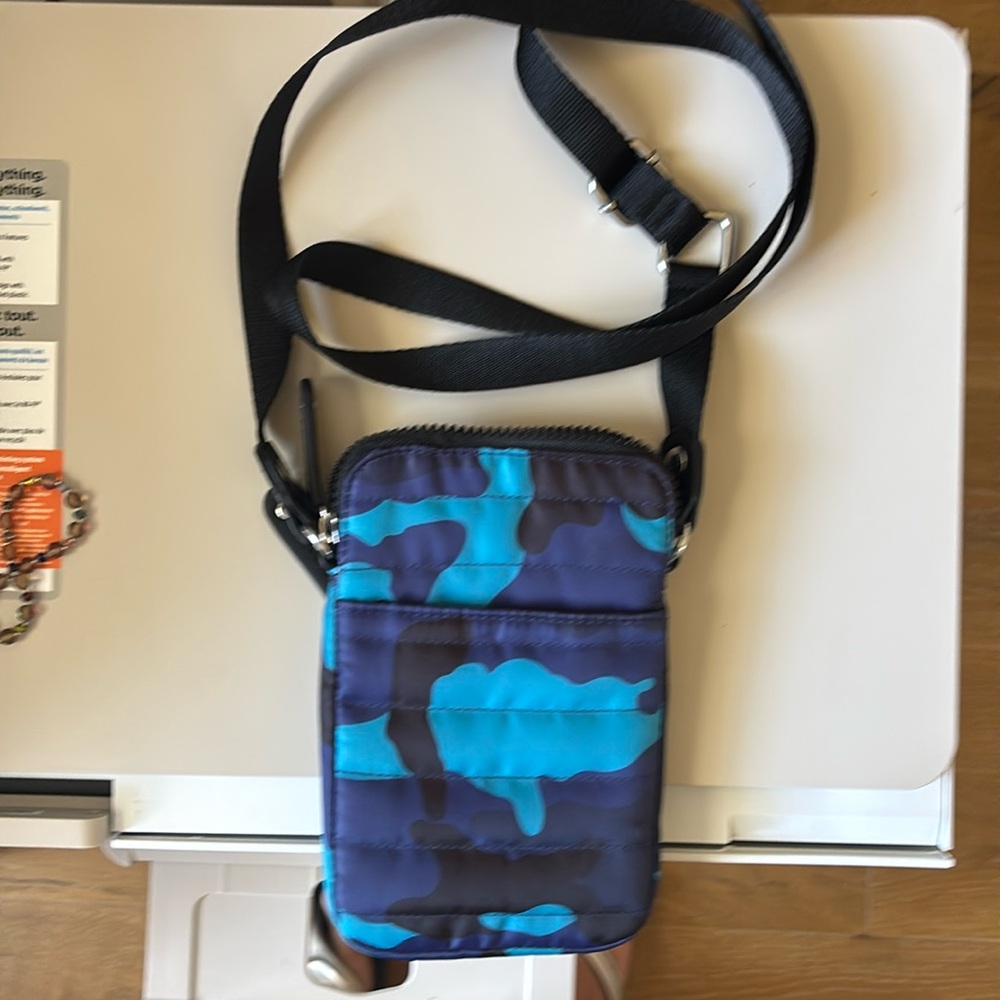 Sandra Robert’s Squared purse, cell phone bag. Long strap, outside pockets.